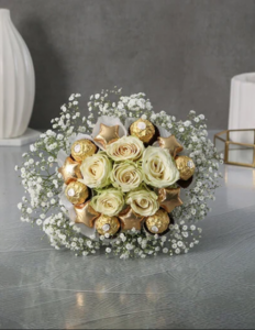 Yellow roses, gold star chocolates, Ferrero Rochers and Baby's Breaths bouquet. 
