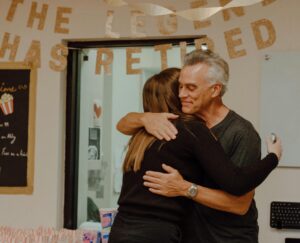 Man Hugging A Woman