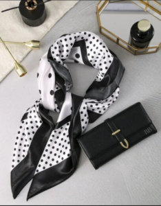 A stylish scarf and a black handbag