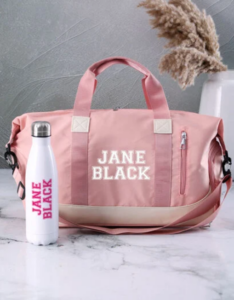 A stylish pink sports bag with a white bottle